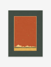 Minimalist starry sky wall art print with golden stars, terracotta sky, rolling hills, and a sandy landscape in a dark green mat.