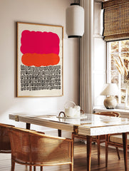 Abstract art print with a large pink cloud shape, an orange organic shape, and rows of black looped symbols, in a styled room