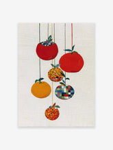 Modern fruit wall art featuring five stylized red and orange fruits with patterned details hanging from strings on a white background.