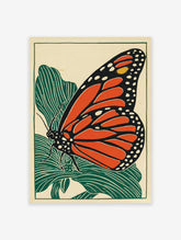 Monarch butterfly wall art print in linocut style with orange wings and green leaves on a cream background.
