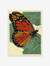 Monarch butterfly woodcut style print with orange, black, and green on a light background with leaves.