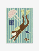 Whimsical monkey wall art showing a scuba diver monkey with flippers, a jellyfish, and fish in striped blue and green water.