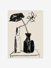 Black ink still life drawing of a lily and monstera leaf in a glass bottle and black vase