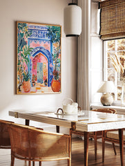 Vibrant Moroccan Archway Poster with blue intricate patterns, a pink wall, and lush green and orange potted plants. - Image 2