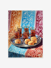 Watercolor painting of Moroccan tea glasses and pastries on a silver tray, set on a vibrant patterned textile.