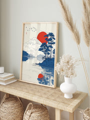 Japanese landscape art print showing Mount Fuji, a red sun, blue pine trees, birds, and, in an alternate framed mockup