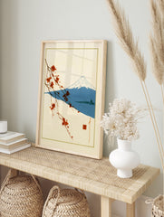 Japanese-style print of a flowering branch, Mount Fuji, and a pagoda on a cream background, in an alternate framed mockup