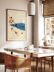 Japanese-style print of a flowering branch, Mount Fuji, and a pagoda on a cream background, in a styled room mockup