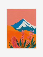 Colorful mountain landscape wall art with pink flowers, orange hills, and a snow-capped peak under a coral sky.