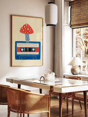 Illustrative art print of a red spotted mushroom growing from a blue cassette tape on a cream, in a styled room mockup