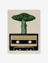 Linocut style illustration of a green mushroom growing out of a dark blue cassette tape on a tan paper background