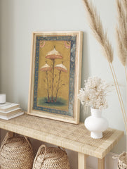 Botanical illustration of three stylised mushrooms with white spotted caps, pink gills, and, in an alternate framed mockup