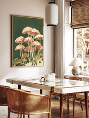 Illustrative print of cream and reddish-brown mushrooms with green foliage on a dark green, in a styled room mockup