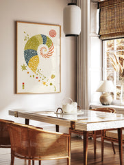 Illustrative nautilus shell art print with patterned segments, starfish, and spiral motifs on a, in a styled room mockup
