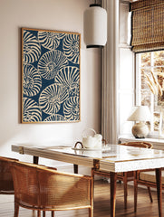 Repeating pattern of navy blue and off-white nautilus seashells in an illustrative graphic style, in a styled room mockup