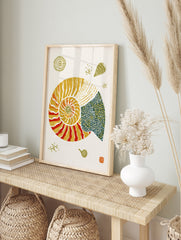 Nautilus shell illustration with orange, yellow, and blue geometric patterns on a white paper, in an alternate framed mockup