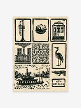 Black and white New Orleans collage print featuring a trumpet, streetcar, alligator, and architectural ironwork symbols