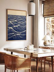 Stylised blue and white lino print of ocean waves with foam crests extending to the horizon, in a styled room mockup