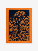 Orange botanical silhouette print with umbel flowers and grasses on navy blue background