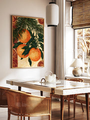 Illustrative botanical wall art of three hanging oranges on a pine branch with decorative circular, in a styled room mockup