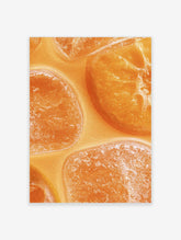 Close-up macro photograph of vibrant orange citrus fruit slices submerged in clear liquid