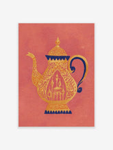 Ornate golden teapot with dark blue accents and intricate patterns on a coral background, showing a mosque within