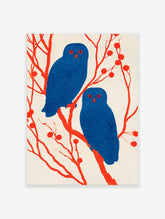 Illustrative owl wall art featuring two blue owls with red eyes perched on red branches with berries against a light background.