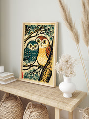 Japanese woodcut style print of two owls, one teal and one orange, perched on a pine tree branch with green needles. - Image 3