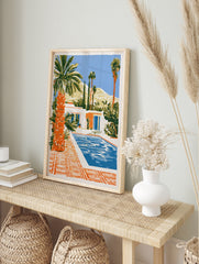Illustrative art print of a modern desert house with a swimming pool, palm trees, and, in an alternate framed mockup