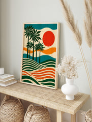 Illustrative palm tree wall art with green trees, orange sun, and wavy stripes in a tropical, in an alternate framed mockup