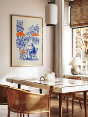 Illustrated blue and orange cafe poster depicting a couple at a Parisian street cafe with buildings in the background. - Image 2