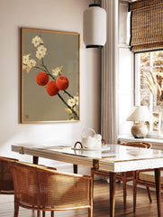 Traditional oriental wall art print featuring three red peaches and white blossoms on a branch, in a styled room mockup