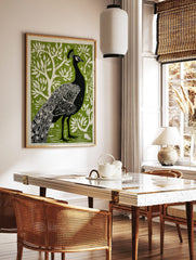 Black peacock with detailed feathers and head crest against a vibrant green stylised tree background, in a styled room mockup