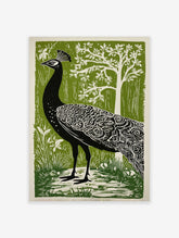 Illustrative black peacock in profile with white feather patterns against a green forest background print