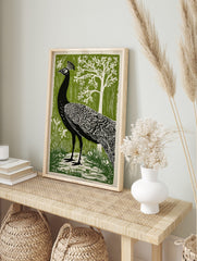 Black peacock with white feather details, green forest background, white tree, illustrative, in an alternate framed mockup