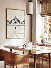 Sketch illustration of a penguin walking on ice, leaving footprints, with large mountains in the, in a styled room mockup