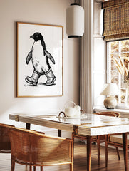 Black and white illustrative print of a penguin wearing rubber wellington boots on a plain white, in a styled room mockup