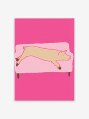 Whimsical pig wall art illustration showing a light brown pig sleeping on a light pink couch against a vibrant pink background.