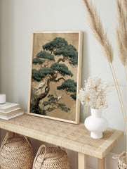 Illustrative print of a large pine tree with white and grey cranes on branches against a, in an alternate framed mockup