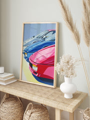 Vibrant sports car poster featuring three classic cars in pink, blue, and white, with a light blue sky background. - Image 4