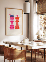Illustrative art print of pink chess queen and orange king with hearts on a light background, in a styled room mockup