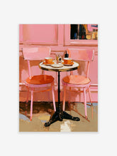 Pink cafe art print with orange chairs, round bistro table, coffee cups, and painterly brushstrokes