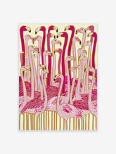Illustrated pink flamingo flock wall art with gold outlines on cream background