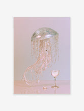 Pink jellyfish wall art print with glass dome, pearl strands, and wine glass on pink background