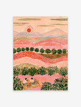 Pink landscape art print with red sun, green trees, and two figures picnicking on a rug