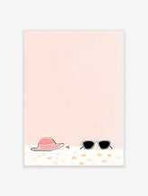 Illustrative print of a pink sun hat, black sunglasses, and red starfish on sand with a peach background