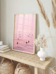 Pink surfer poster showing multiple surfers on a calm, shimmering pink ocean under a pastel sky. - Image 4