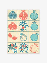 Grid of illustrative pomegranate fruit and branch designs in red and blue on a textured cream background
