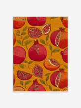 Illustrative Pomegranate wall art print with whole and sliced red and orange pomegranates and green leaves on a textured yellow background.