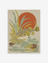 Japanese style puffer fish wall art with yellow fins, green-brown body, red sun, and aquatic plants